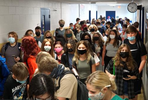 A full hallway of face-masked Emerson Middle School students fill the hallway just before 8 a.m. on Sept. 7, 2021.Backtoschoollivonia1