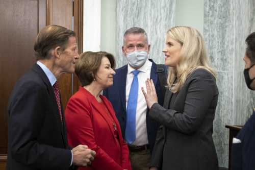 Sen. Richard Blumenthal (D-CT) and Sen. Amy Klobuchar (D-MN) speak with former Facebook employee Frances Haugen as she arrives for a Senate Committee on Commerce, Science, and Transportation hearing entitled 'Protecting Kids Online: Testimony from a Facebook Whistleblower' on Capitol Hill October 5, 2021 in Washington, DC.