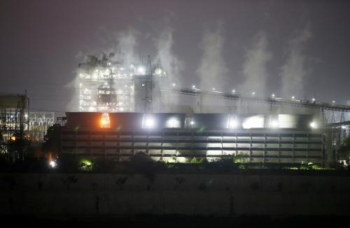 FILE PHOTO: Smoke billows from the cooling towers of a coal-fired power plant in Ahmedabad, India, October 13, 2021. REUTERS/Amit Dave/File Photo