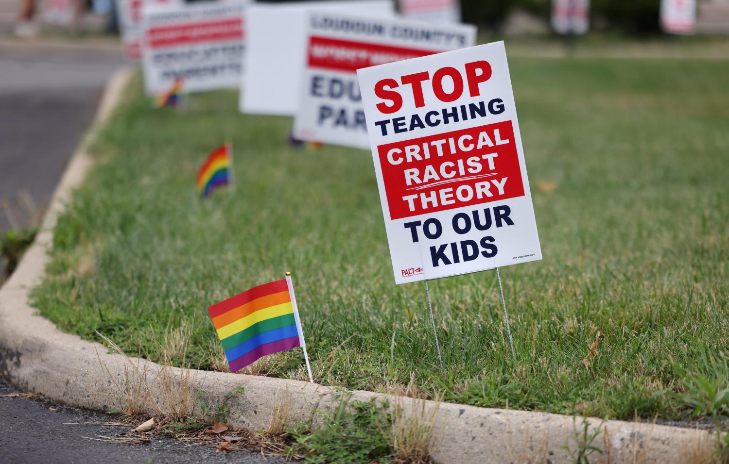 Signs opposing Critical Race Theory line the entrance to the Loudoun County School Board headquarters, in Ashburn, Virginia, U.S. June 22, 2021. REUTERS/Evelyn Hockstein