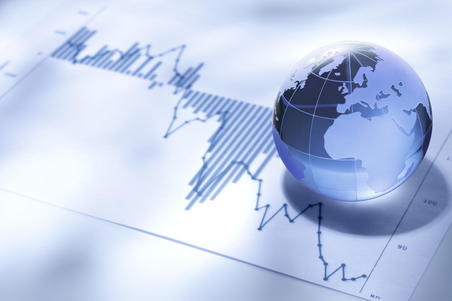 Globe over financial charts