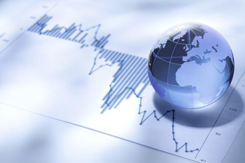 Globe over financial charts