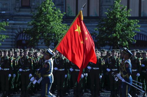 Soldiers of China's People's Liberation Army carry a state flag before the Victory Day Parade in Red Square in Moscow, Russia, June 24, 2020. The military parade, marking the 75th anniversary of the victory over Nazi Germany in World War Two, was scheduled for May 9 but postponed due to the outbreak of the coronavirus disease (COVID-19). Pavel Golovkin/Pool via REUTERS