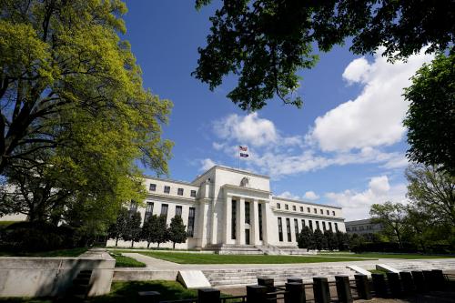 FILE PHOTO: The Federal Reserve building is set against a blue sky in Washington, U.S., May 1, 2020. REUTERS/Kevin Lamarque/File Photo