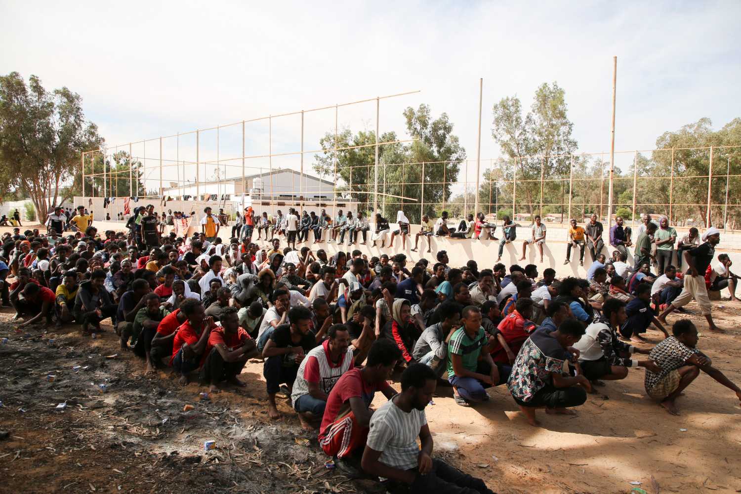 Migrants gather at a detention center at Ain Zara, in Tripoli, Libya October 12, 2021. REUTERS/Hazem Ahmed