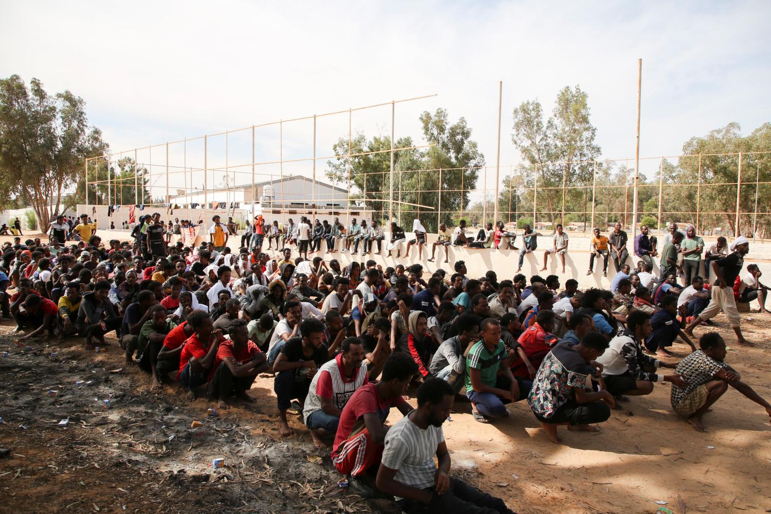 Migrants gather at a detention center at Ain Zara, in Tripoli, Libya October 12, 2021. REUTERS/Hazem Ahmed