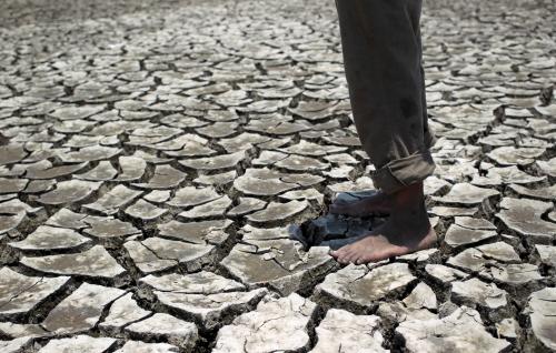 A man stands on the dried ground at the Tisma lagoon wetland park due to drought affecting Tisma town, Nicaragua April 20,2016. REUTERS/Oswaldo Rivas