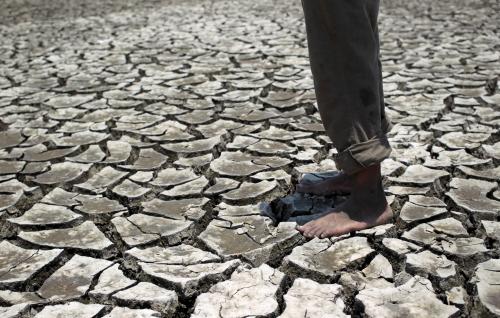 A man stands on the dried ground at the Tisma lagoon wetland park due to drought affecting Tisma town, Nicaragua April 20,2016. REUTERS/Oswaldo Rivas
