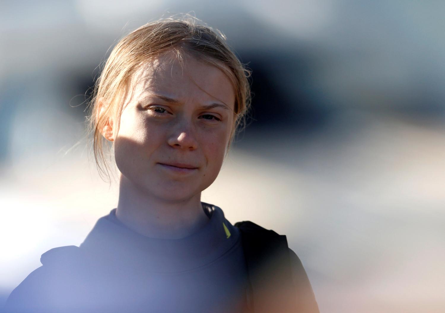 Climate change activist Greta Thunberg looks on upon her arrival at Santo Amaro port in Lisbon, Portugal December 3, 2019. REUTERS/Pedro Nunes