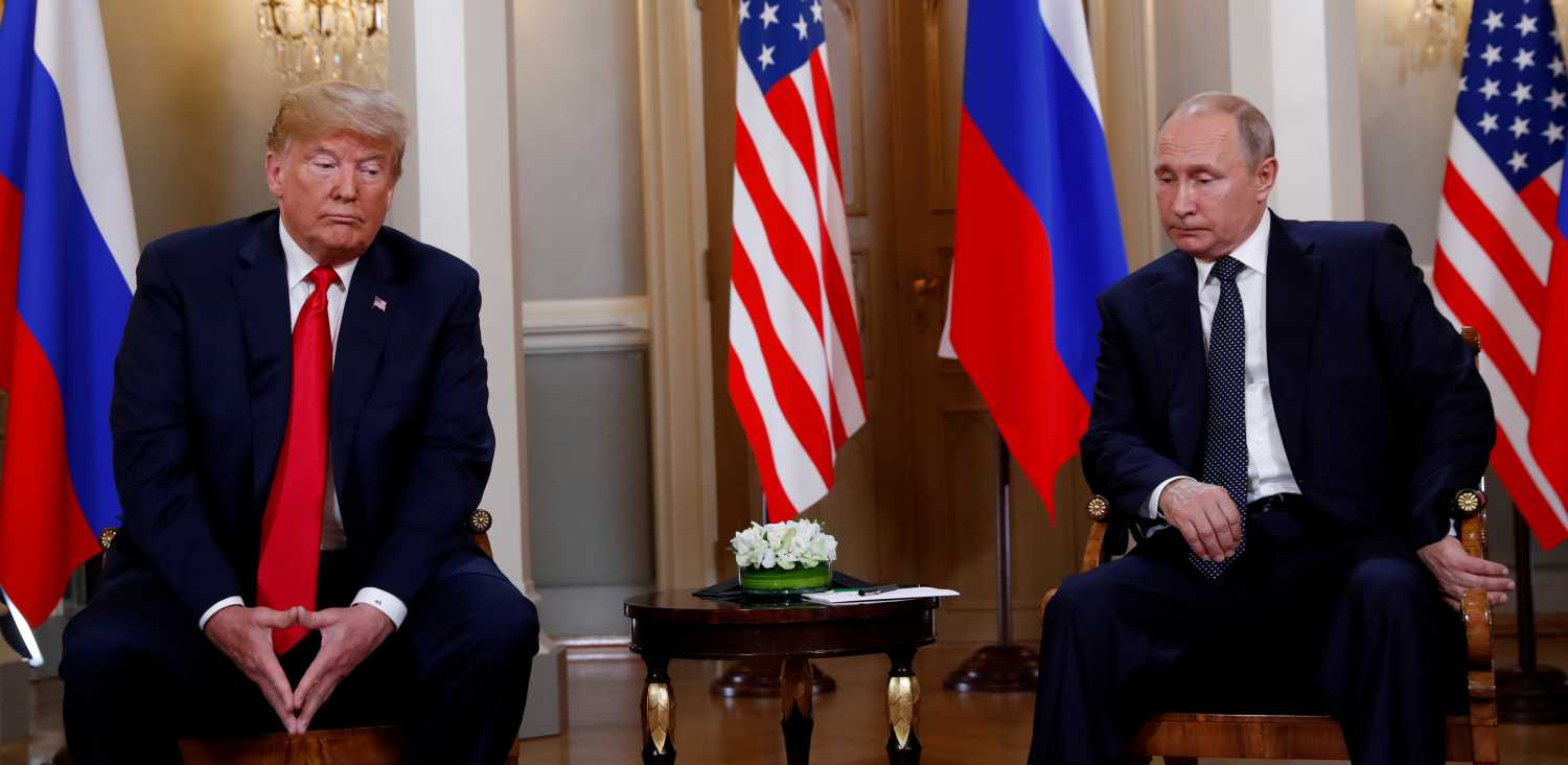 U.S. President Donald Trump meets with Russian President Vladimir Putin in Helsinki, Finland, July 16, 2018. Reuters photographer Kevin Lamarque: "Body language can give an ordinary photo much more meaning, and here, Trump and Putin did not disappoint." REUTERS/Kevin Lamarque     SEARCH "TRUMP POY" FOR FOR THIS STORY. SEARCH "REUTERS POY" FOR ALL BEST OF 2018 PACKAGES. TPX IMAGES OF THE DAY.