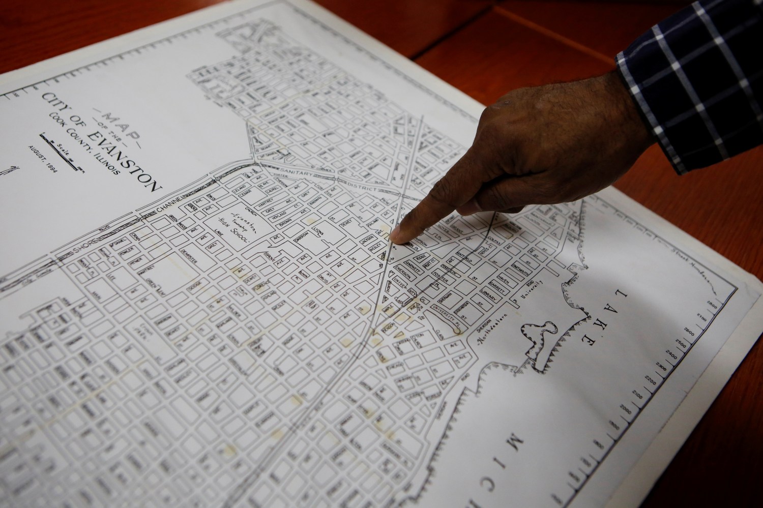 Community historian Morris “Dino” Robinson, who helped shape the Evanston’s reparations initiative, points to the borders of the Fifth Ward, which was the area of Evanston the city’s Black citizens were forced to move to due to redlining between 1919 and 1969, in Evanston, Illinois, U.S March 17, 2021. REUTERS/Eileen T. Meslar