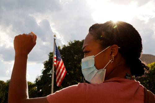 Adelana Akindes takes part in a demonstration against racial injustice by the Coalition to March on the Democratic Convention outside the site of the DNC, which will be a largely virtual event due to the coronavirus disease (COVID-19) outbreak, in Milwaukee, Wisconsin, U.S., August 17, 2020.   REUTERS/Brian Snyder     TPX IMAGES OF THE DAY