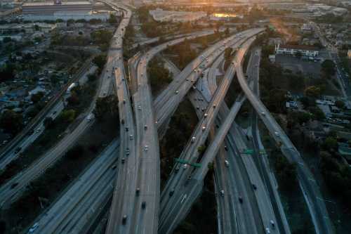 An aerial view shows traffic on the East Los Angeles Interchange complex, the busiest freeway interchange in the world, in Los Angeles, California, U.S. August 10, 2021. Interstate 5 (I-5), Interstate 10 (I-10), U.S. Route 101 (US 101), and State Route 60 (SR 60) all converge at the East Los Angeles Interchange. Picture taken with a drone. REUTERS/Bing Guan