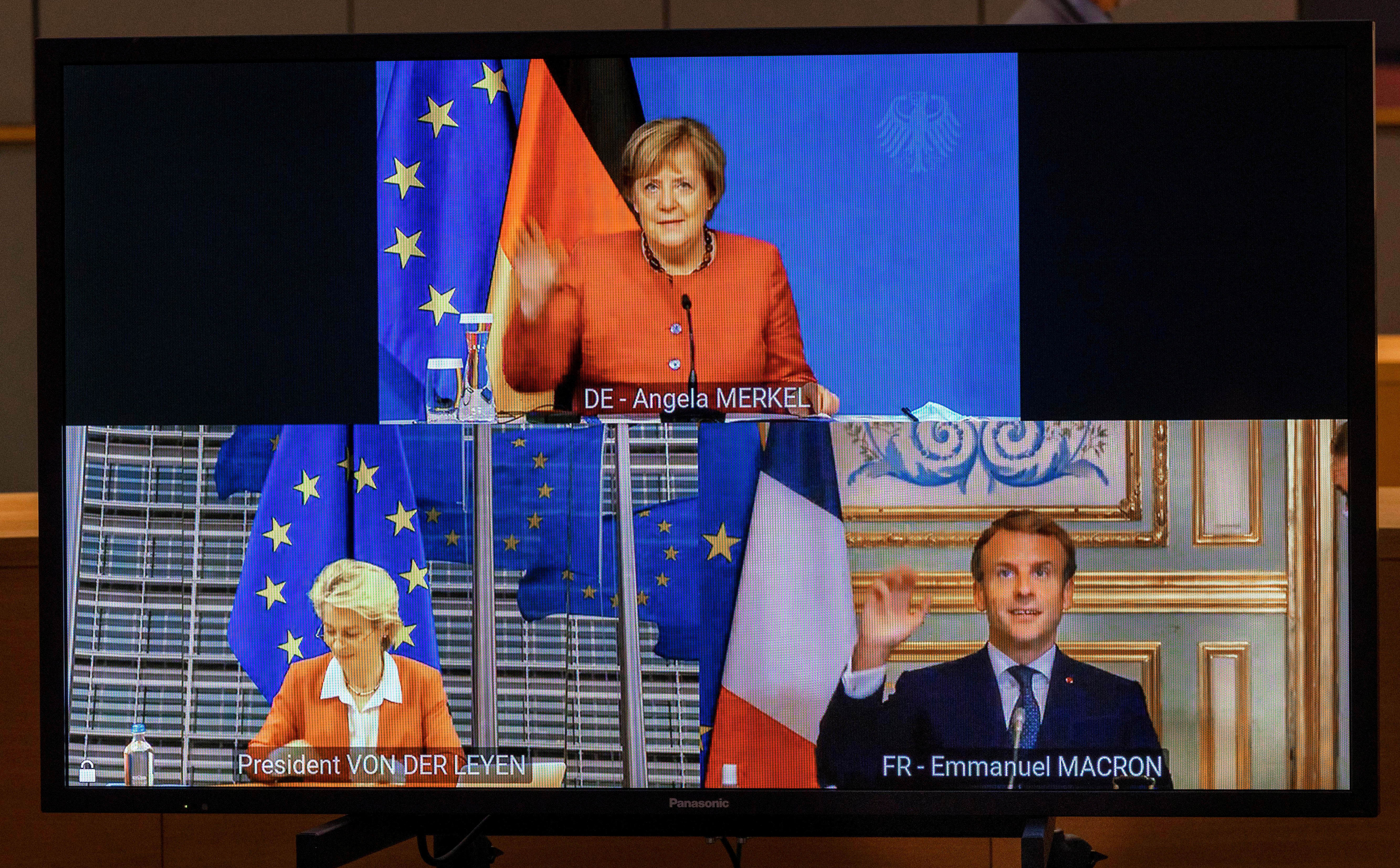 German Chancellor Angela Merkel, French President Emmanuel Macron and European Commission President Ursula von der Leyen speak with European Council President Charles Michel via videoconference at the European Council building in Brussels, Belgium October 20, 2021. Michel is meeting with several EU leaders prior to an EU summit which begins Thursday. Olivier Matthys/Pool via REUTERS