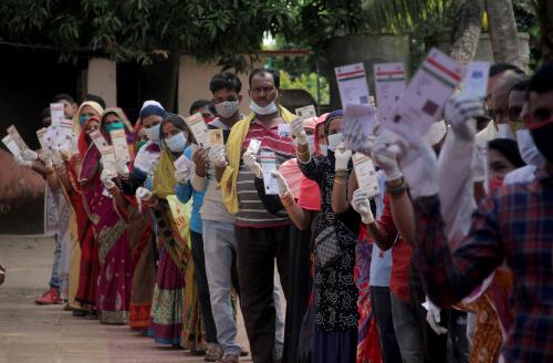 Local village voters are seen in the queue with the proper Covid-19 guidelines as they wait to cast their votes on the bi-election as one of a winning candidate had died before the assembly election term ends at Pipili election constituency of Puri district neighbored of the eastern Indian state Odishas capital city Bhubaneswar. Local volunteers help voters to cast their votes smoothly as these areas in today surrounded and keep alerts by the police forces after a little bit violence happened before the polling. EYEPRESS/Biswaranjan Rout