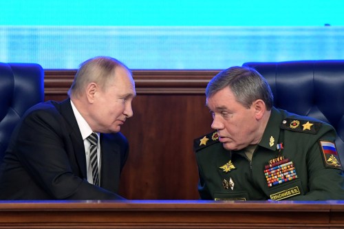 MOSCOW, RUSSIA - DECEMBER 21, 2021: Russia's President Vladimir Putin (L) and Russia's First Deputy Defense Minister Valery Gerasimov, the chief of the General Staff of the Russian Armed Forces, attend an extended meeting of the Russian Defense Ministry Board at the National Defense Control Center. Sergei Guneyev/POOL/TASS.No use Russia.