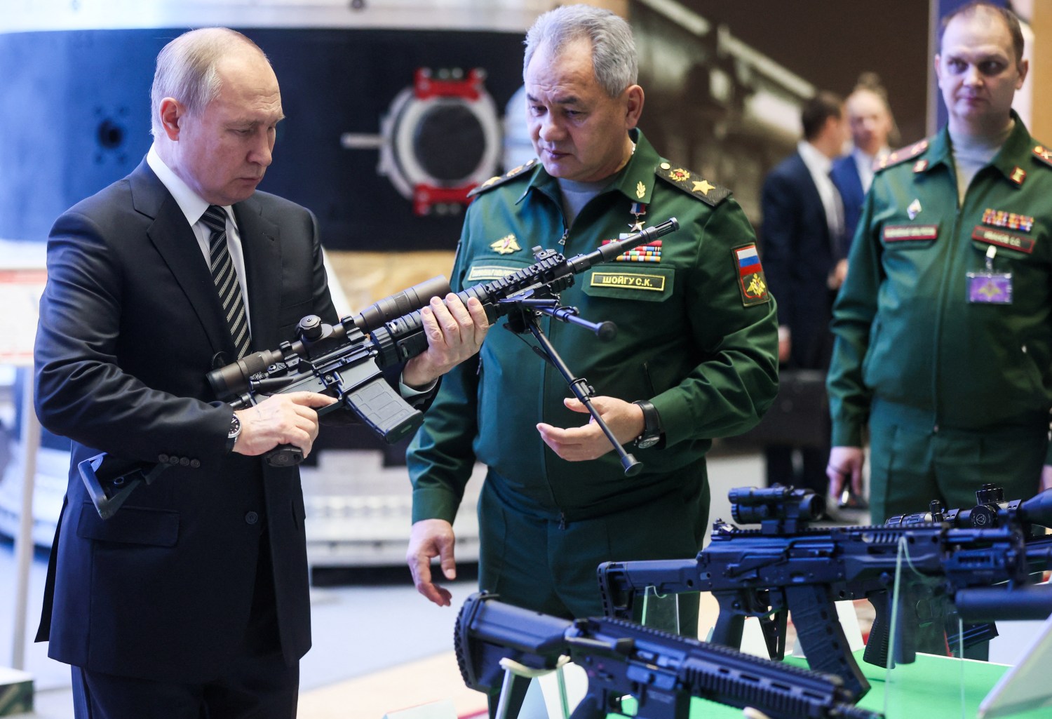 Russian President Vladimir Putin and Defence Minister Sergei Shoigu attend a military exhibition before an expanded meeting of the Defence Ministry Board in Moscow, Russia December 21, 2021. Sputnik/Mikhail Metzel/Pool via REUTERS