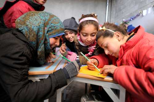 Students sit inside a classroom in Aleppo's Jibreen shelter, Syria February 1, 2017. Picture taken February 1, 2017. REUTERS/Omar Sanadiki - RC12505779A0