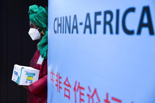 A hostess stands before the opening of the Forum on China-Africa Cooperation, (FOCAC) in Dakar, Senegal November 29, 2021. REUTERS/Cooper Inveen