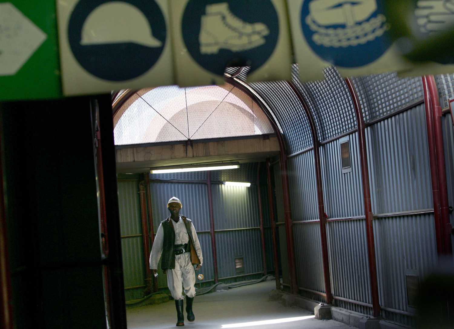 A mineworker returns at the end of an underground shift at the Harmony Gold Mine's Doornkop shaft near Johannesburg, South Africa.  A mineworker returns at the end of an underground shift at the Harmony Gold Mine's Doornkop shaft near Johannesburg, South Africa August 17, 2005. South Africa's gold mines are back in full production after the end last week of the first industry-wide industrial strike in 18 years, with firms hoping they may be able to make up some lost production. Picture taken August 17, 2005. REUTERS/Mike Hutchings