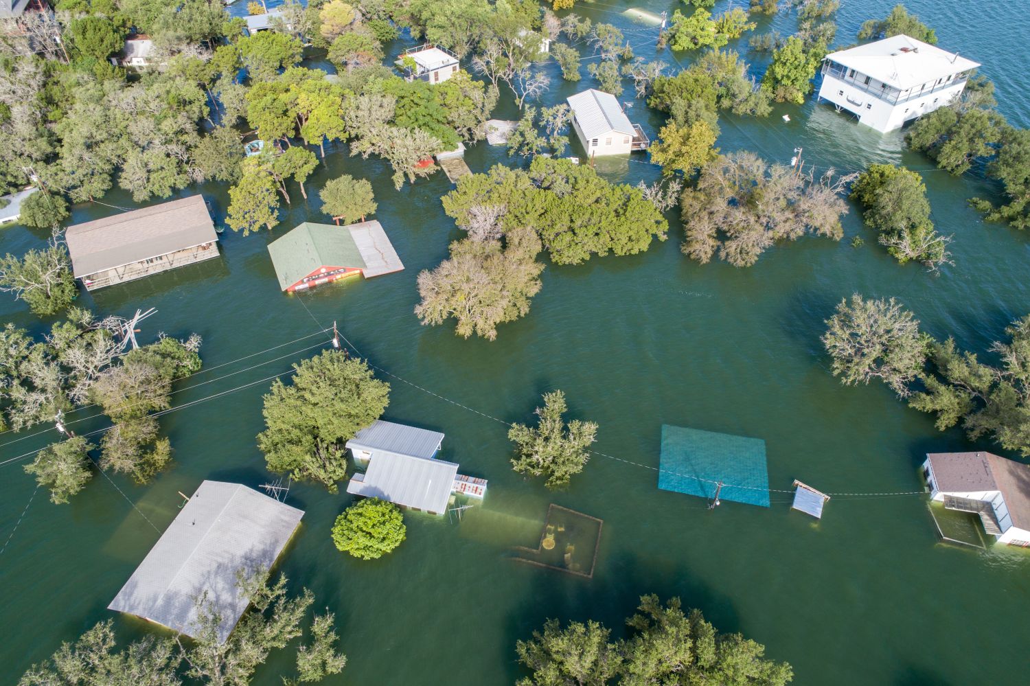 Home submerged under water in history flooding in Central Texas