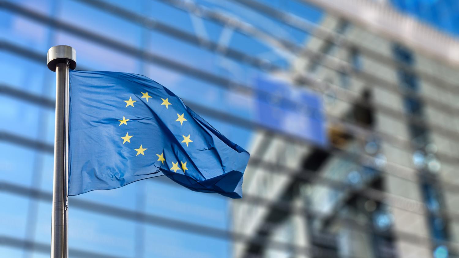 European Union flag in front of the Berlaymont building (European commission) in Brussels, Belgium.