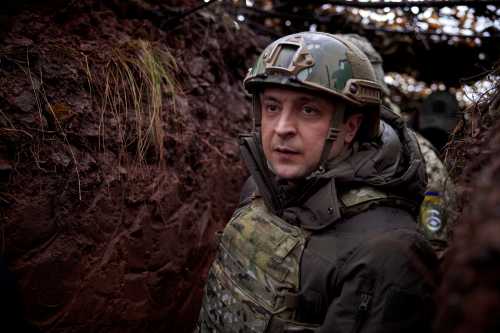 FILE PHOTO: Ukraine's President Volodymyr Zelenskiy meets with the country's service members at the combat positions near the line of separation from Russian-backed rebels on the Day of the Armed Forces in the Donetsk region, Ukraine December 6, 2021. Ukrainian Presidential Press Service/Handout via REUTERS ATTENTION EDITORS - THIS IMAGE WAS PROVIDED BY A THIRD PARTY./File Photo