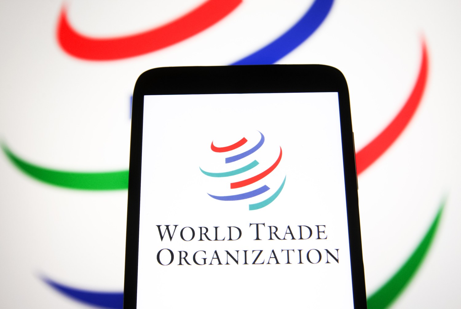 In this photo illustration a World Trade Organization (WTO) logo is seen on a smartphone screen. (Photo by Pavlo Gonchar / SOPA Images/Sipa USA)No Use Germany.