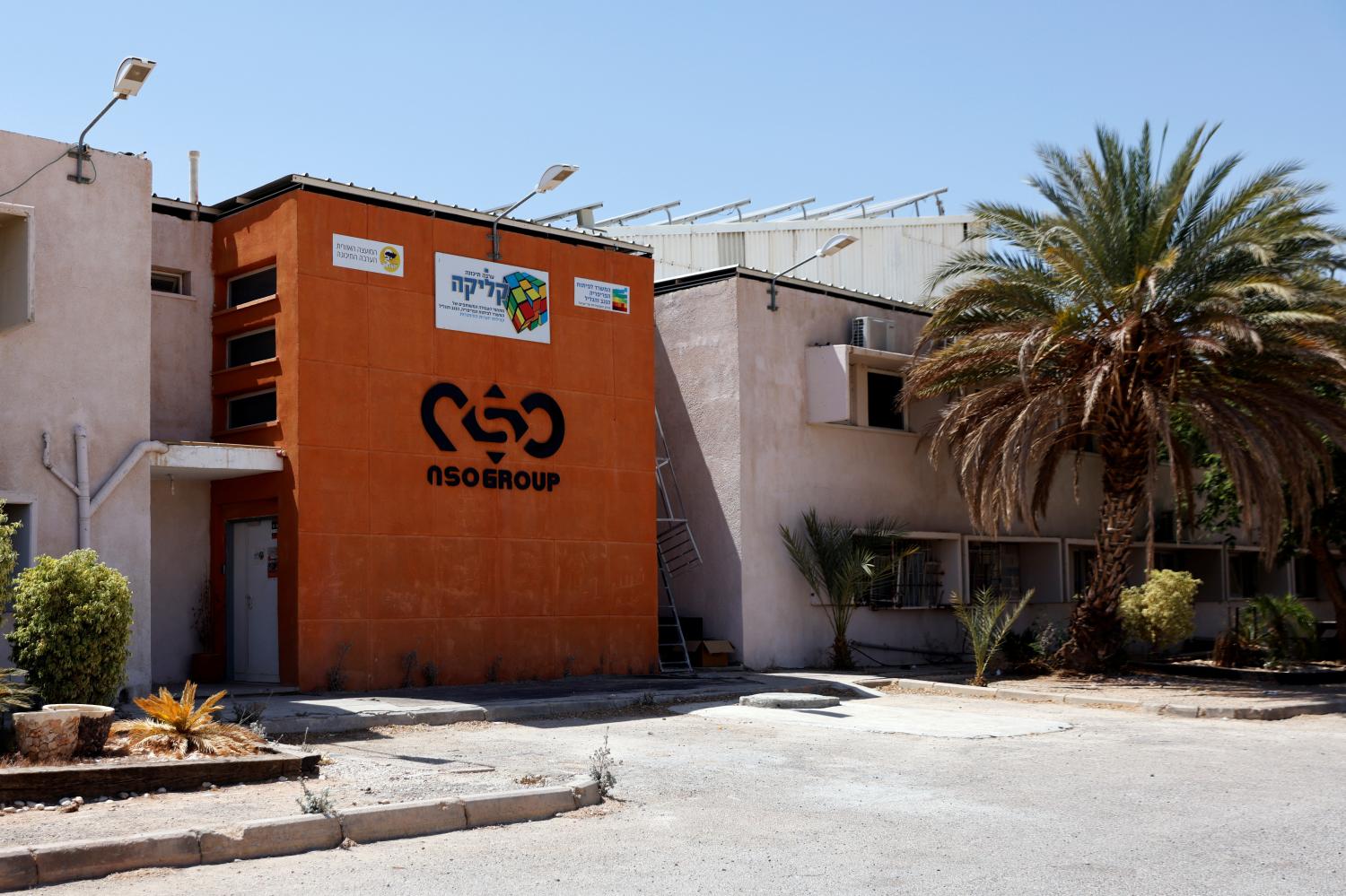 The logo of Israeli cyber firm NSO Group is seen at one of its branches in the Arava Desert, southern Israel July 22, 2021. REUTERS/Amir Cohen