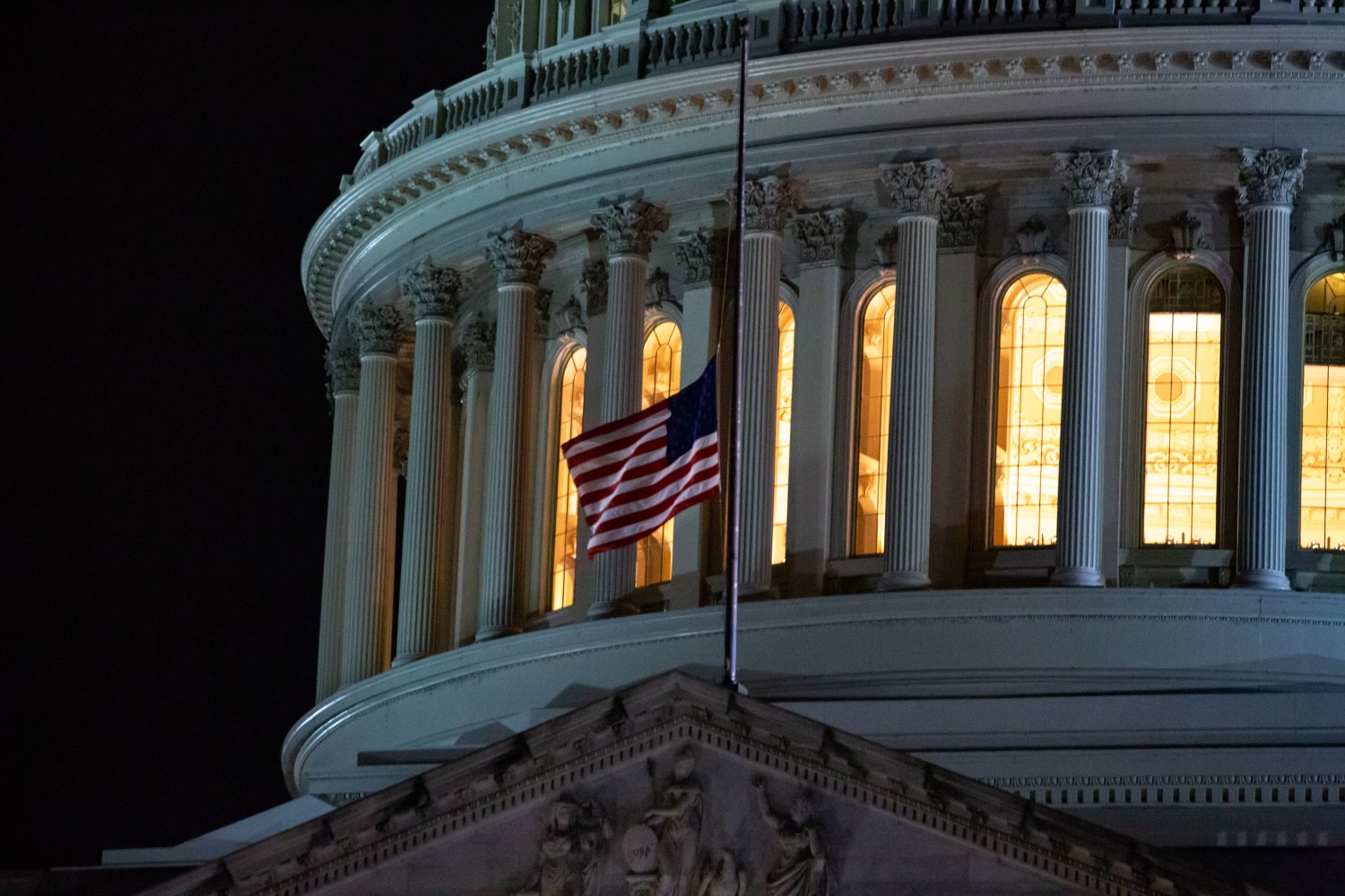 A U.S. flag at the Capitol building flies at half staff on January 6, 2022, the one year anniversary of the insurrection at the Capitol building (Photo by Bryan Olin Dozier/NurPhoto)NO USE FRANCE