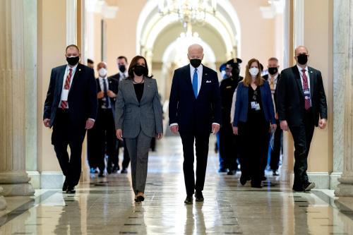 U.S. Vice President Kamala Harris and U.S. President Joe Biden walk through the Hall of Columns on the one-year anniversary of the January 6, 2021 attack on the Capitol in Washington, U.S., January 6, 2022. Stefani Reynolds/Pool via REUTERS