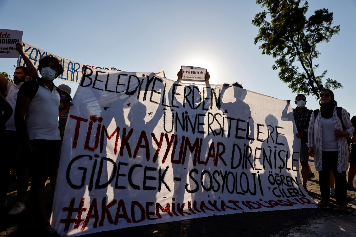Students gather to protest against what they say is government interference in academia despite President Tayyip Erdogan's ousting of Melih Bulu, a rector whose appointment in January triggered months of demonstrations, in Istanbul, Turkey, July 16, 2021. The banner reads "All the government-appointed trustees at municipalities and universities will go". REUTERS/Umit Bektas
