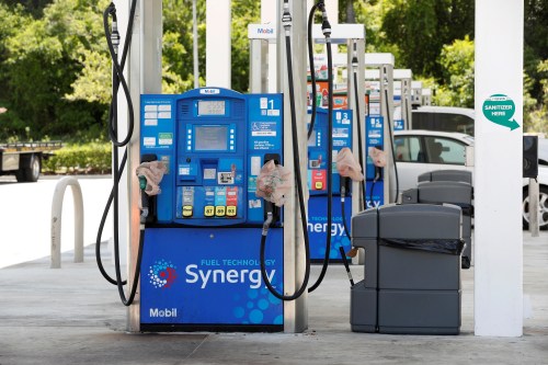 Plastic bags covering fuel pumps to signal no gas is available is seen at a 7-Eleven gas station after a cyberattack crippled the biggest fuel pipeline in the country, run by Colonial Pipeline, in Lakeland, Florida, U.S. May 14, 2021. REUTERS/Octavio Jones