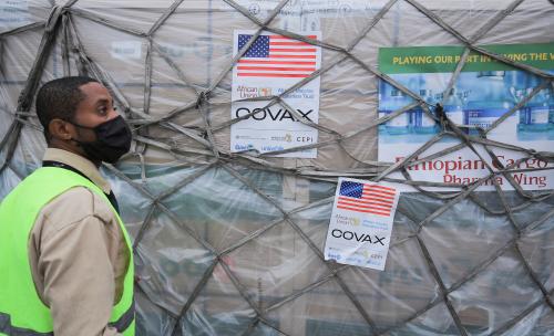 An Ethiopian Airlines Cargo terminal worker looks on as he offloads a shipment of Johnson & Johnson's coronavirus disease (COVID-19) vaccines that arrived under the COVAX scheme, at the Bole International Airport in Addis Ababa, Ethiopia July 19, 2021. REUTERS/Tiksa Negeri