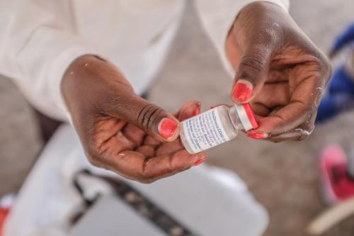 A health worker holds an Oxford-AstraZeneca COVID-19 vaccine vial in Kibera Slum.Despite the everyday challenges and effects of a change in climate and weather conditions, lack of proper health care systems, lack of jobs opportunities and employments including the poor housing and living conditions, residents of Kibera Slums struggle up and down to make all ends meet as they try to get back to normalcy despite the loses made in businesses a midst the corona Virus pandemic. Most residents have taken advantage of the free covid-19 vaccinations provided by the government around the surrounding villages inside the community. (Photo by Donwilson Odhiambo / SOPA Images/Sipa USA)No Use Germany.