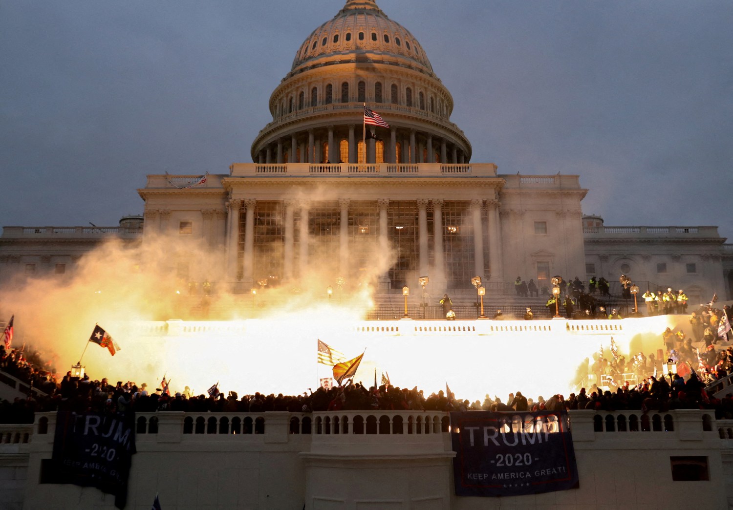 FILE PHOTO: An explosion caused by a police munition is seen while supporters of U.S. President Donald Trump riot at the U.S. Capitol Building in Washington, U.S., January 6, 2021. REUTERS/Leah Millis/File Photo