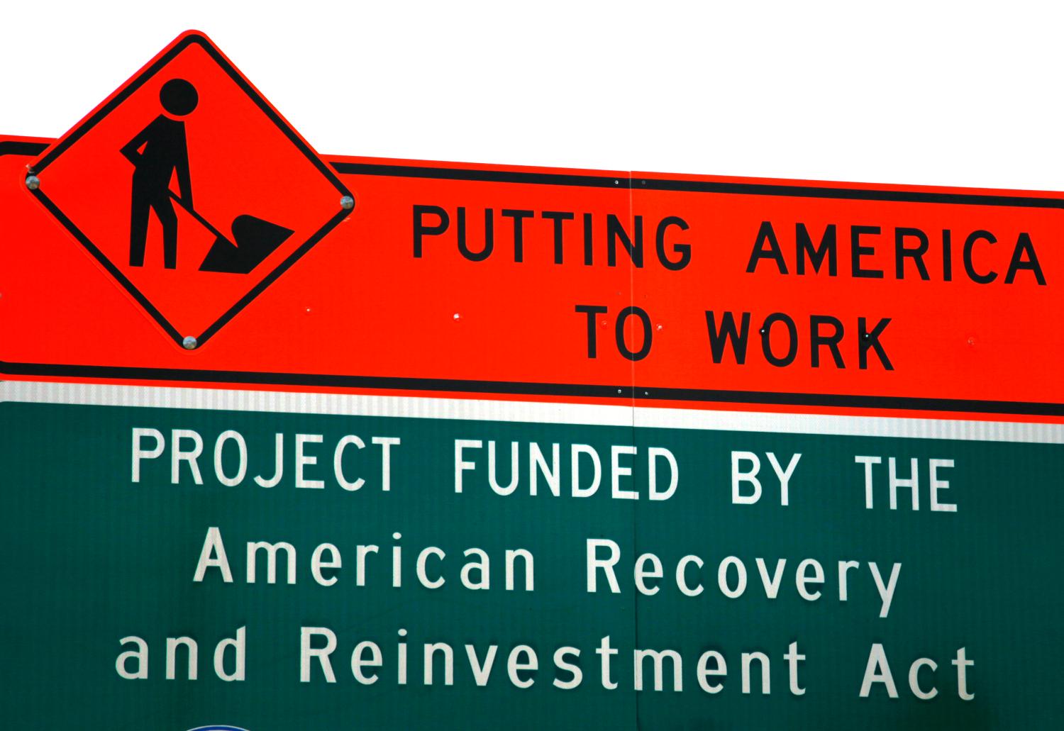 A sign announces a section of road work funded by the American Recovery and Reinvestment Act U.S. economic stimulus plan in the Denver area September 10, 2009. The White House Council of Economic Advisers said that the $787 billion stimulus package enacted earlier this year had created as many as 1.1 million jobs by the third quarter.  REUTERS/Rick Wilking (UNITED STATES BUSINESS SOCIETY)