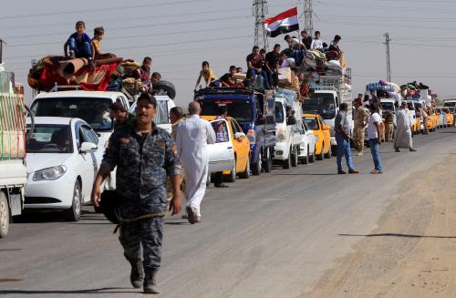 Displaced people riding in trucks and cars head back to their homes in Hawija, on the outskirts of Kirkuk, Iraq October 18, 2017. REUTERS/Alaa Al-Marjani