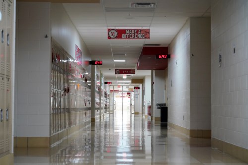 Hallways sit empty ahead of the statewide school closures in Ohio in an effort to curb the spread of the coronavirus, inside Milton-Union Exempted Village School District in West Milton, Ohio, U.S., March 13, 2020. REUTERS/Kyle Grillot    REFILE - CORRECTING NAME OF SCHOOL