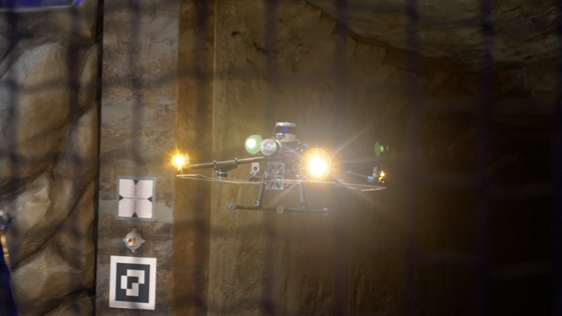 A U.S. Government-funded competition has seen autonomous robots battling against each other in an underground cave complex.
The DARPA Subterranean (SubT) Challenge took place at the Louisville Mega Cavern September 21-24, 2021. DARPA – the Defense Advanced Research Projects Agency – is a research and development agency of the U.S. Department of Defense responsible for the development of emerging technologies for use by the military.
With $5 million in total prize money at stake, competitors were tasked with entering robots that could navigate courses and obstacles.
Teams in the Systems Competition element of the event developed a wide variety of robotic systems to advance and evaluate novel mapping and navigation solutions for application in realistic field environments, such as human-made tunnels, urban underground settings, and caves.
The Systems Competition involved physical robots and a Virtual Competition took place in simulated underground worlds. Four of the teams competed in both competitions.
Teams in the Virtual Competition developed software and algorithms using virtual models of systems, environments, and terrain to compete in simulation-based events, and explore simulated environments.
CERBERUS won the Systems Competition and Dynamo topped the leaderboard in the Virtual Competition as roboticists and engineers from eleven countries participated in the Final Event. The Systems and Virtual winners won $2 million and $750,000, respectively.
“In time-sensitive missions, such as active combat operations or disaster response, warfighters and first responders face difficult terrain, unstable structures, degraded environmental conditions, severe communication constraints, and expansive areas of operation,” said Timothy Chung, program manager of the SubT Challenge. “The Challenge has helped to significantly advance technological tools for tackling these impediments and safeguarding lives.”
Since the SubT Challenge began in 2018, teams