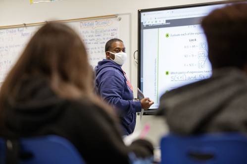Fairview Middle School sixth grade math teacher Breshaun Chambers teaches his class a new algebra lesson Thursday, Feb. 10, 2022.Fairview Magnet Program084