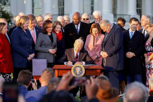 U.S. President Joe Biden signs the "Infrastructure Investment and Jobs Act", on the South Lawn at the White House in Washington, U.S., November 15, 2021. REUTERS/Jonathan Ernst     TPX IMAGES OF THE DAY