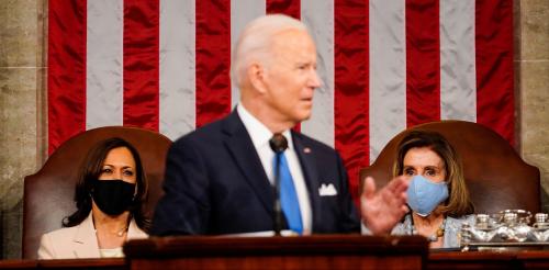 President Joe Biden addresses a joint session of Congress, with Vice President Kamala Harris and House Speaker Nancy Pelosi (D-Calif.) on the dais behind him, in Washington, U.S., April 28, 2021.   Melina Mara/Pool via REUTERS