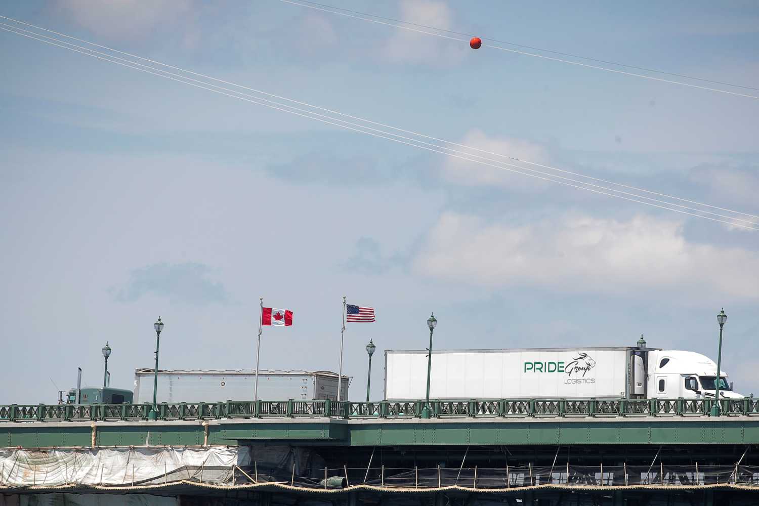 Trucks cross The Peace Bridge, which runs between Canada and the United States, over the Niagara River in Buffalo, New York, U.S. July 15, 2020. REUTERS/Brendan McDermid