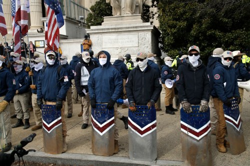 Members of the Patriot Front hold flags and shields during a demonstration on January 21, 2022 in Washington D.C. USA. The group of white nationalists form a coalition of a broader alt-right movement in the US. Members maintain an Americana aesthetic  with traditional American culture, patriotism and broad national values to promote their ideology. (Photo by John Lamparski/Sipa USA)No Use Germany.