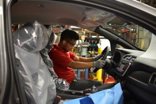 A line worker installs the steering wheel on the flex line at Nissan Motor Co's automobile manufacturing plant in Smyrna, Tennessee, U.S., August 23, 2018. Picture taken August 23, 2018. REUTERS/William DeShazer
