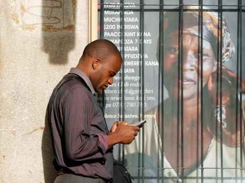 A man checks his mobile phone, in Harare, Zimbabwe, January 21, 2019. REUTERS/Philimon Bulawayo