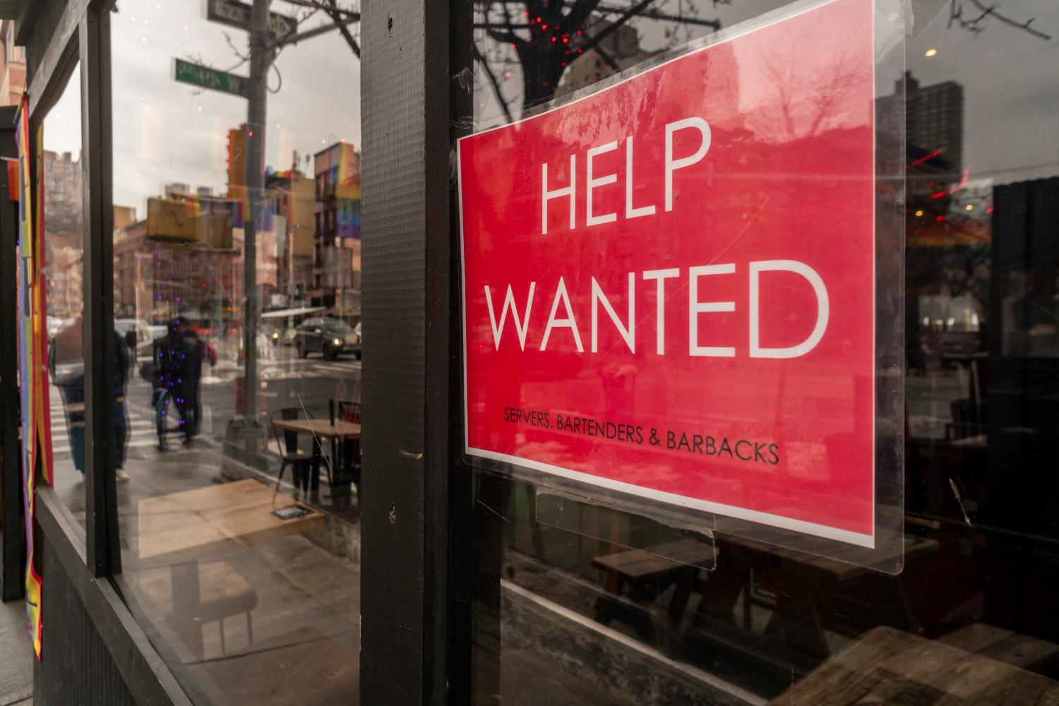 Help wanted sign in a restaurant window in HellÕs Kitchen in New York on Sunday, January 9, 2022. (Photo by Richard B. Levine)No Use Germany.