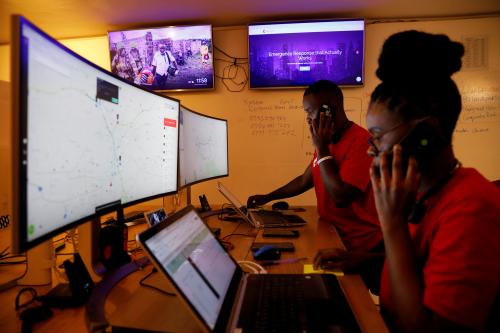 Dispatchers for the Rescue.co free ambulance service look at computer screens during the coronavirus night curfew in Nairobi, Kenya June 11, 2020. Picture taken June 11, 2020.  REUTERS/Baz Ratner  REFILE - CORRECTING SERVICE'S NAME