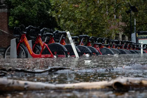 A shared bicycle station is partially submerged in high water in Old Town Alexandria, Virginia on October 29, 2021 during heavy rains and high tides (Photo by Bryan Olin Dozier/NurPhoto)NO USE FRANCE